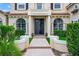 Grand home entrance featuring a manicured lawn, and an elegant walkway, that guides you to the ornate front door at 2357 Alaqua Dr, Longwood, FL 32779