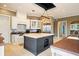 Open kitchen features granite countertops, stainless steel appliances, and custom cabinetry at 2357 Alaqua Dr, Longwood, FL 32779