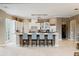 Spacious kitchen featuring a central island with seating, white cabinetry, and an open layout great for entertaining at 2357 Alaqua Dr, Longwood, FL 32779