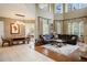 Open-concept living room with high ceilings, hardwood floors, and a dining area at 2357 Alaqua Dr, Longwood, FL 32779
