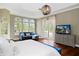 The main bedroom is bright and airy with double doors that lead to the pool area at 2357 Alaqua Dr, Longwood, FL 32779