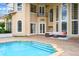 Back exterior of home with pool and outdoor seating area at 2357 Alaqua Dr, Longwood, FL 32779