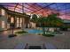 Stunning screened-in pool and spa with lush landscaping and ample patio space for entertaining at 2357 Alaqua Dr, Longwood, FL 32779