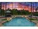 Inviting screened-in pool area with spa and tropical landscaping, perfect for relaxation and outdoor enjoyment at 2357 Alaqua Dr, Longwood, FL 32779