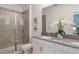 Bathroom featuring double sinks with a glass shower and a beautifully decorated counter at 3004 Protagonist St, Kissimmee, FL 34746