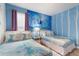 Themed bedroom features two twin beds and a vibrant Frozen-themed mural at 3004 Protagonist St, Kissimmee, FL 34746