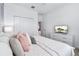 Bright bedroom features a comfortable bed, bedside tables and mounted television at 3004 Protagonist St, Kissimmee, FL 34746