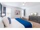 Bedroom features modern dresser with TV, a crib, and stylish wall art at 3004 Protagonist St, Kissimmee, FL 34746
