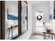 Hallway featuring a console table with lamps and a mirror at 3004 Protagonist St, Kissimmee, FL 34746
