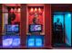 The game room with Batman and Joker themed arcade games and neon-lit decor at 3004 Protagonist St, Kissimmee, FL 34746