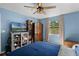 Bright bedroom with ceiling fan, large window, and ample space at 3028 Parkway Blvd # 308, Kissimmee, FL 34747