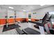 Community gym space with weight lifting machines, treadmills, weight racks, and rubber flooring at 3028 Parkway Blvd # 308, Kissimmee, FL 34747
