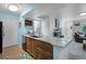 Well-designed kitchen with granite countertops, wood cabinets, and an open layout at 3028 Parkway Blvd # 308, Kissimmee, FL 34747