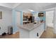 Charming kitchen with granite counters, blue walls, and access to a bathroom at 3028 Parkway Blvd # 308, Kissimmee, FL 34747