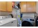 Bright laundry area with modern appliances and ample storage space at 3028 Parkway Blvd # 308, Kissimmee, FL 34747