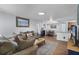 Inviting living room open to the dining area features wood flooring and comfortable seating at 3028 Parkway Blvd # 308, Kissimmee, FL 34747