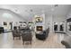 Modernly furnished lounge with grey couches, a fireplace, a vaulted ceiling, and double doors at 3028 Parkway Blvd # 308, Kissimmee, FL 34747
