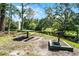 Scenic picnic area by the water features a grill, table, and lush landscaping for outdoor enjoyment at 3028 Parkway Blvd # 308, Kissimmee, FL 34747