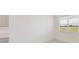 Bright, neutral dining area with carpet and a window with a view of the outside at 3088 Windswept, Wildwood, FL 34785