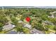 Desirable neighborhood featuring a cozy home, lots of mature trees, and established landscaping at 310 E Gulley Ave, Oakland, FL 34760
