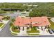 Aerial view of the townhome complex including lush landscaping and mature trees at 3336 Gray Fox Cv # 3336, Apopka, FL 32703