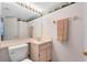 Well-lit bathroom with a large mirror and nautical themed wallpaper border at 3336 Gray Fox Cv # 3336, Apopka, FL 32703