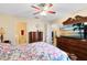 Bedroom with a television and a dresser with an attached mirror at 3336 Gray Fox Cv # 3336, Apopka, FL 32703