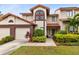 Charming two-story townhome with well-manicured landscaping, attached garage and inviting front entrance at 3336 Gray Fox Cv # 3336, Apopka, FL 32703