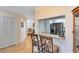 View from breakfast bar of kitchen area with stainless steel refrigerator at 3336 Gray Fox Cv # 3336, Apopka, FL 32703