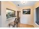 View of the kitchen from the bar area with white cabinetry and appliances at 3336 Gray Fox Cv # 3336, Apopka, FL 32703