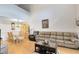 Open-concept living room and dining area featuring neutral tones, wood floors, and comfortable furniture at 3336 Gray Fox Cv # 3336, Apopka, FL 32703