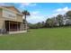 Large backyard featuring a screened-in patio and lush, open green space at 4178 Sw 43Rd Cir, Ocala, FL 34474