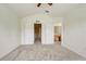 Bedroom featuring doors leading to bathroom, a window, and neutral colored walls and flooring at 4178 Sw 43Rd Cir, Ocala, FL 34474