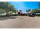 Community clubhouse featuring a parking lot and landscaping at 4178 Sw 43Rd Cir, Ocala, FL 34474