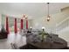 Staged living and dining area featuring hardwood floors, natural light, and modern decor at 4178 Sw 43Rd Cir, Ocala, FL 34474