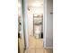 Bright bathroom with decorative shelving, white toilet, and neutral tile floor at 4364 White Pine Ave # 3, Orlando, FL 32811