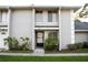 Charming townhouse featuring a well-maintained facade and a cozy entrance, and lush landscaping at 4364 White Pine Ave # 3, Orlando, FL 32811