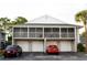 Two story condo/townhouse featuring multiple garages with two-toned paint at 4364 White Pine Ave # 3, Orlando, FL 32811