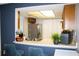 Well-appointed kitchen featuring a breakfast bar with modern stools and stainless steel appliances at 4364 White Pine Ave # 3, Orlando, FL 32811