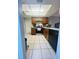 Functional kitchen with wooden cabinets, black appliances, and ample counter space for cooking at 4364 White Pine Ave # 3, Orlando, FL 32811