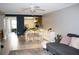 Open-concept living area with dining table, tile floors, and a comfortable couch at 4364 White Pine Ave # 3, Orlando, FL 32811