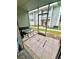 Enclosed porch featuring tile flooring with outdoor seating and a screened door at 4364 White Pine Ave # 3, Orlando, FL 32811