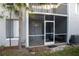 Screened-in patio featuring outdoor seating with a view of the yard at 4364 White Pine Ave # 3, Orlando, FL 32811