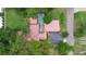 Bird's eye view of the home featuring a screened pool, mature trees, and a private driveway at 4420 Conway Gardens Rd, Orlando, FL 32806