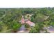 Expansive aerial view of the home, screened-in pool, lush greenery, and ample parking space at 4420 Conway Gardens Rd, Orlando, FL 32806