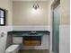 Bathroom features white tile, vanity with a wood base, and walk-in shower at 4420 Conway Gardens Rd, Orlando, FL 32806