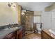 Bathroom featuring a toilet, sink and glass-enclosed shower at 4420 Conway Gardens Rd, Orlando, FL 32806