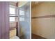 Bathroom featuring tiled walls, shower, and windows for natural light at 4420 Conway Gardens Rd, Orlando, FL 32806