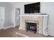 Close up view of fireplace featuring a decorative mantel and black iron screen at 4420 Conway Gardens Rd, Orlando, FL 32806