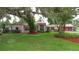 A beautifully landscaped front yard with mature trees gives this home amazing curb appeal at 4420 Conway Gardens Rd, Orlando, FL 32806
